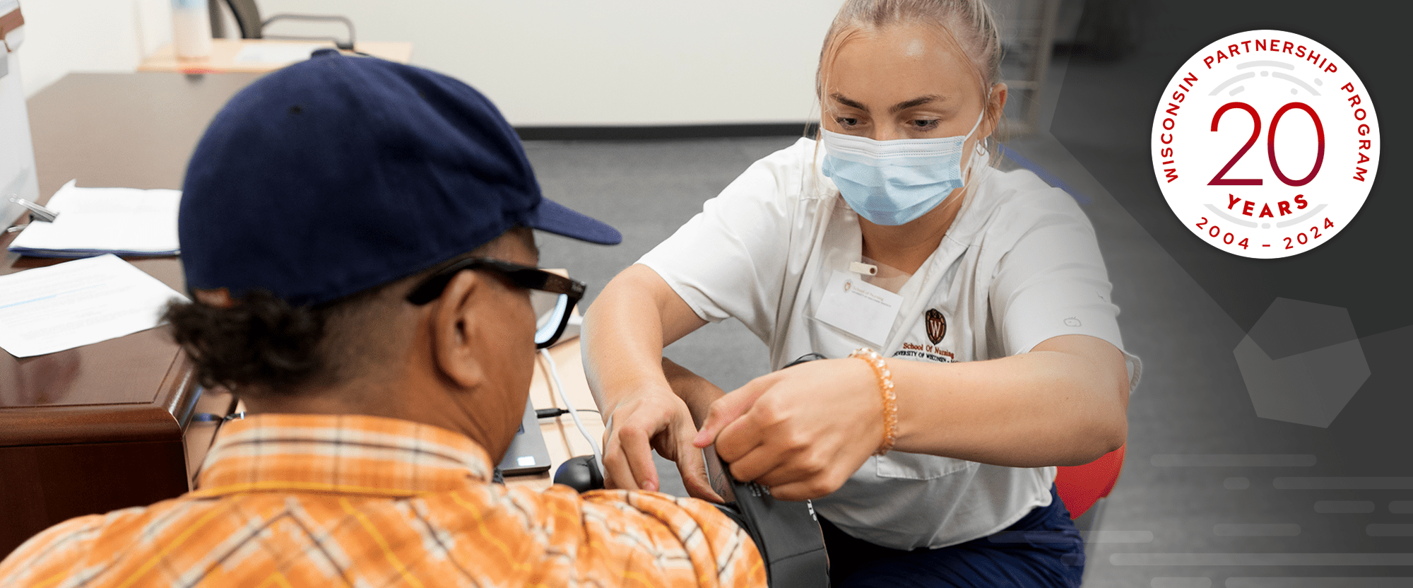 A school of nursing student administers the COVID vaccine