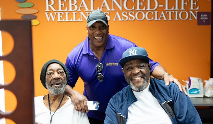 Three men smiling at Rebalanced-Life Wellness Association