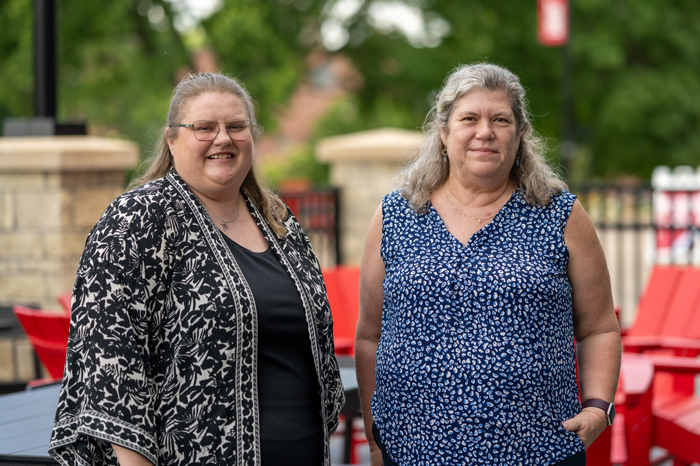 Two women standing outside