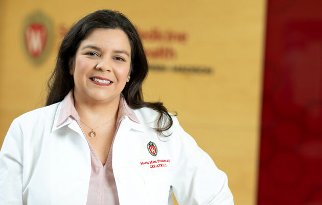 A woman in a white lab coat