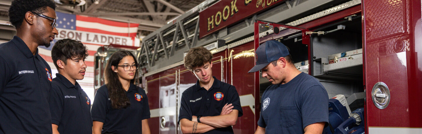 A group of people at a fire station