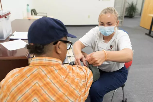 nursing student with a patient