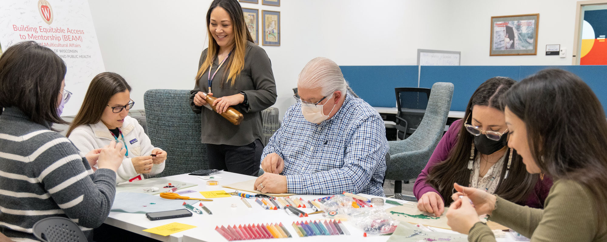 students and staff beading during a Crafternoon in the NACHP office