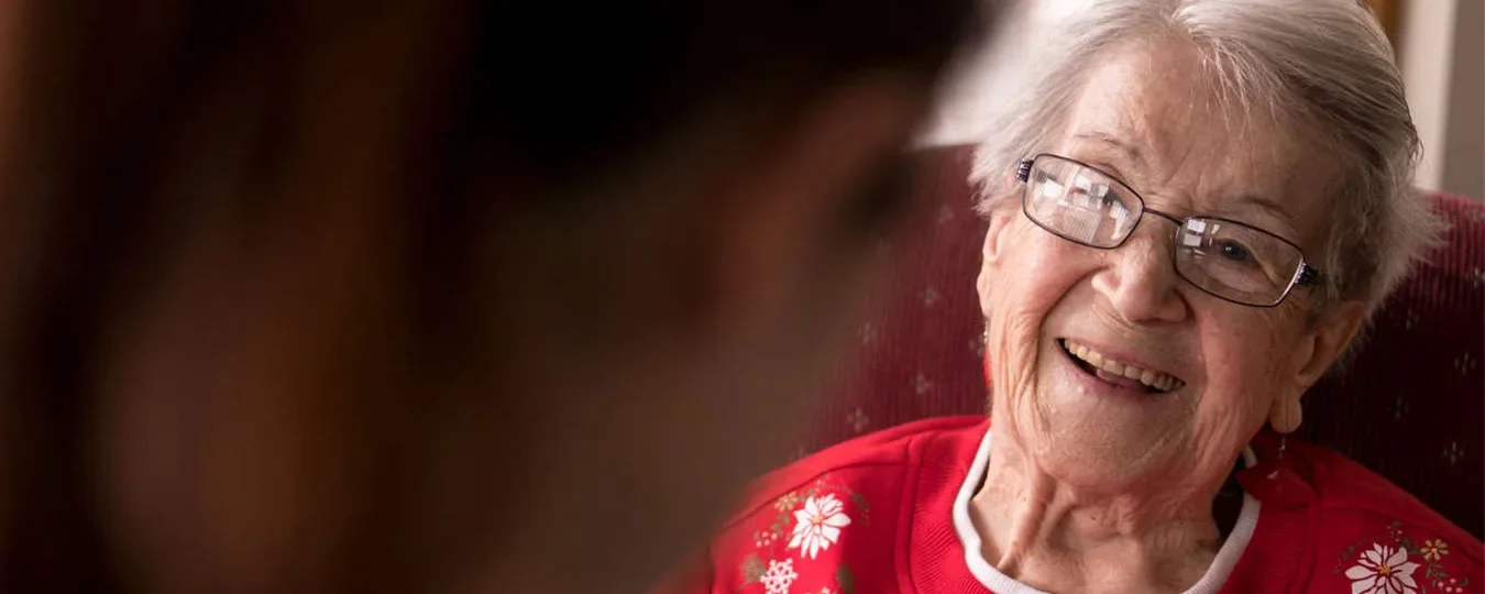 A smiling elderly woman