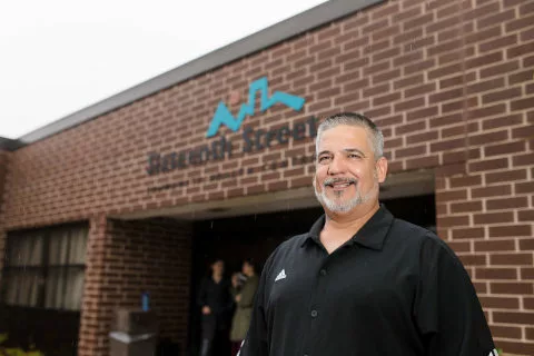 A patient smiles outside Sixteenth Street Health Center